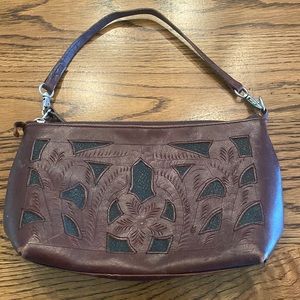 brown and black leather clutch